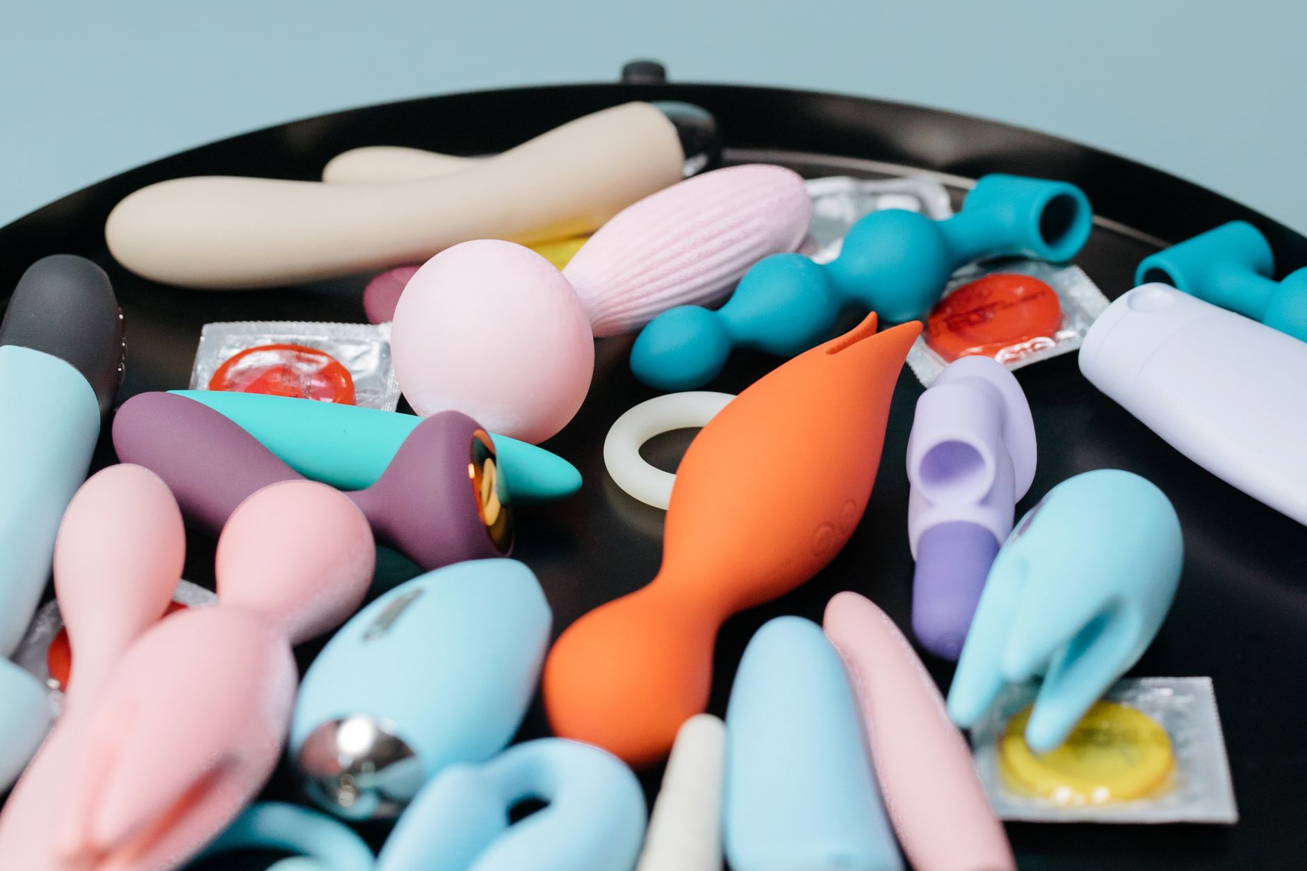 Woman holding vibrators with confidence and intent